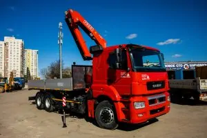 Бортовой автомобиль КАМАЗ AGC64M с КМУ Fassi F155